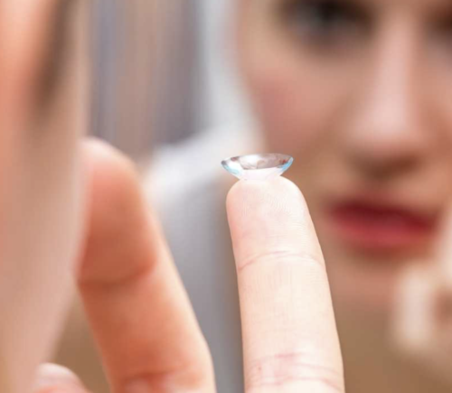 How should you clean and care for contact lenses?
